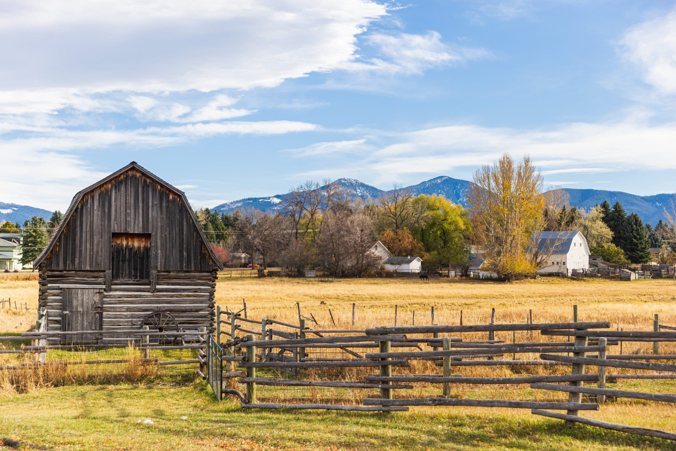 Fenced pasture and a rustic barn in North Georgia